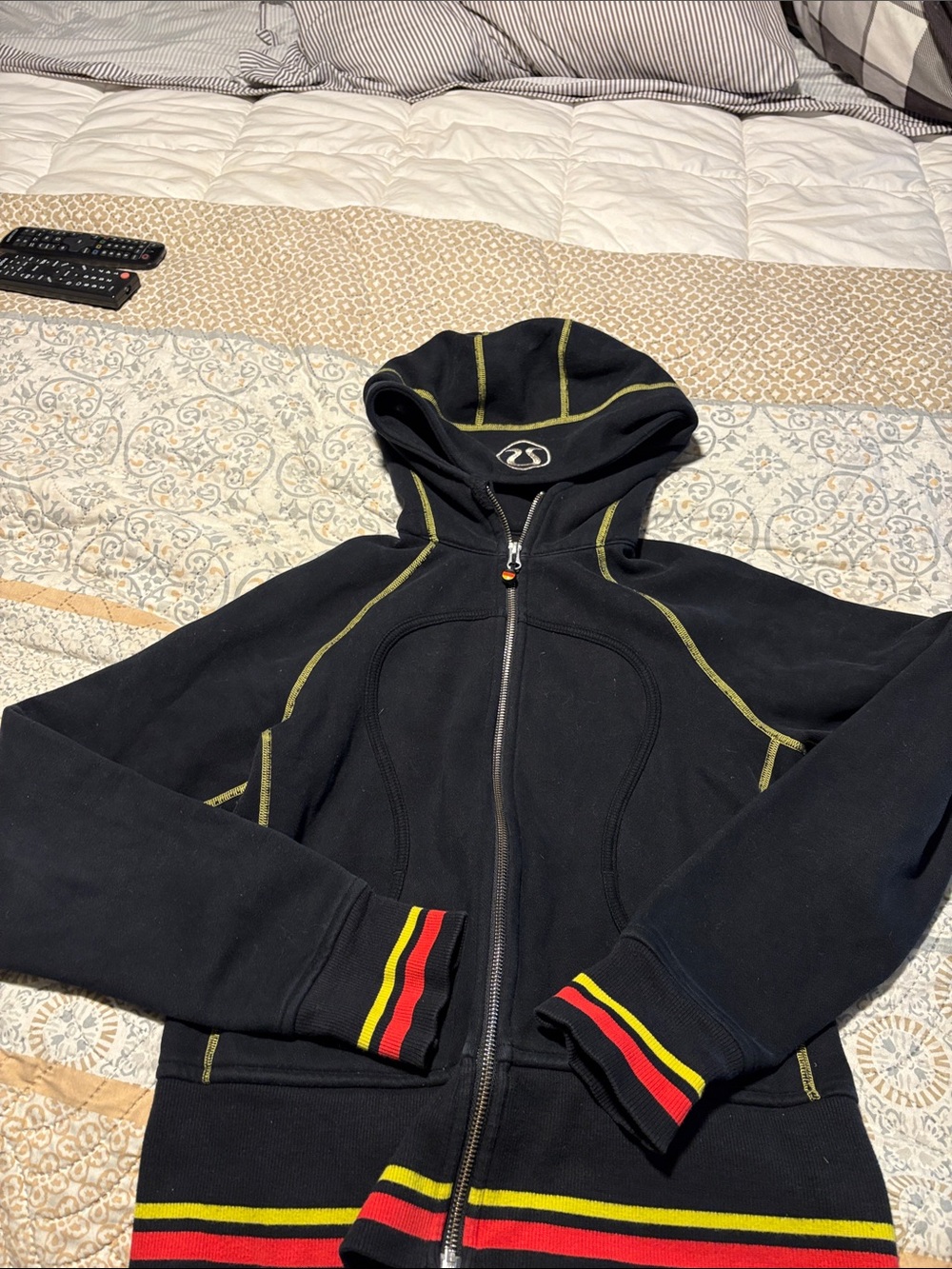 lululemon athletica Black Hooded Zip Jacket with Red & Yellow Stripe Accents